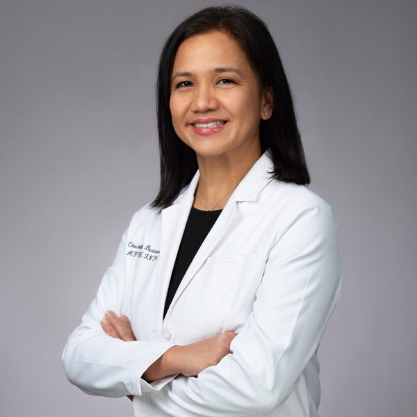 Smiling medical professional in white coat